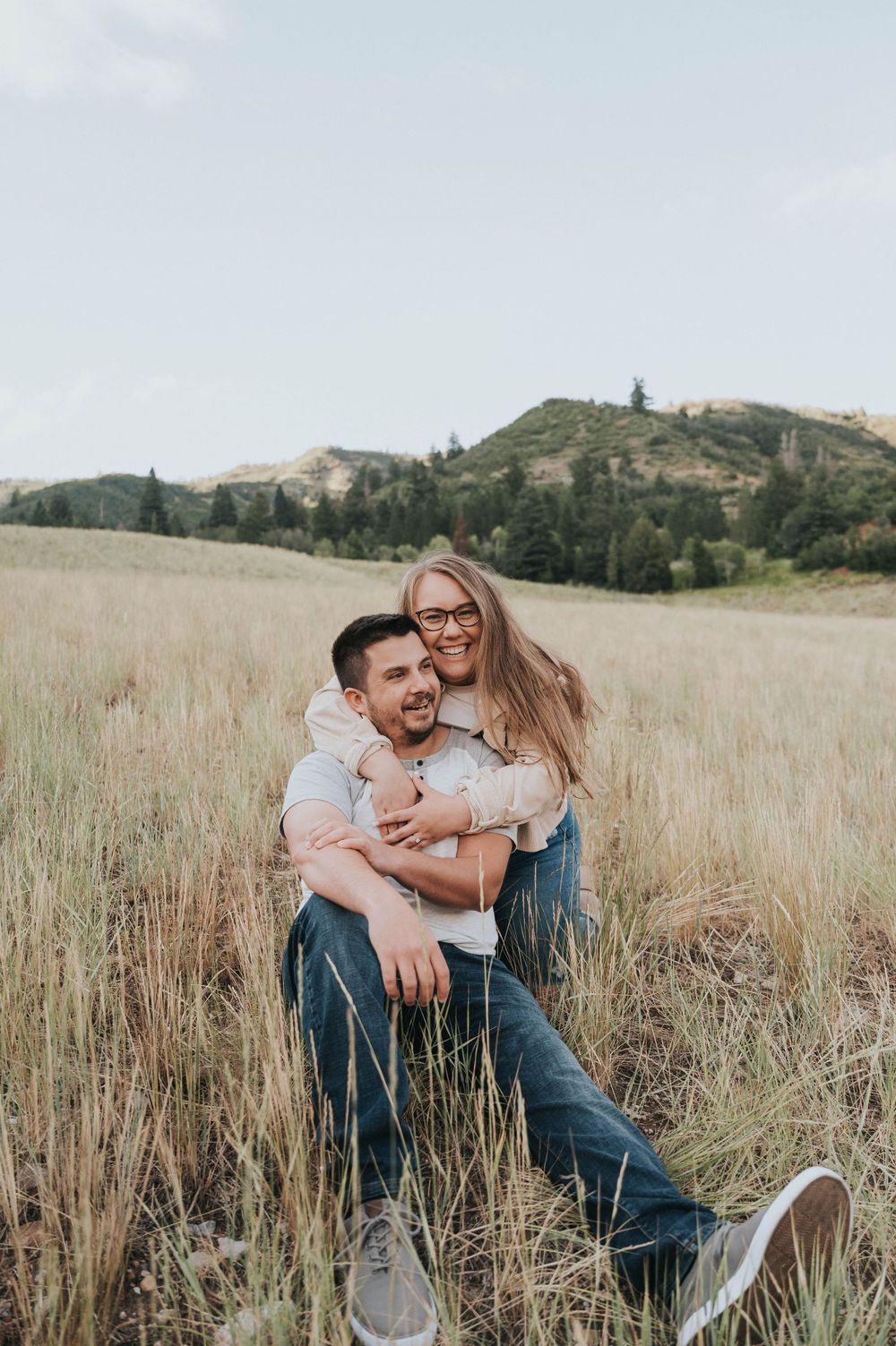 An engaged couple beautifully photographed during their summer engagement session in American Fork Canyon.