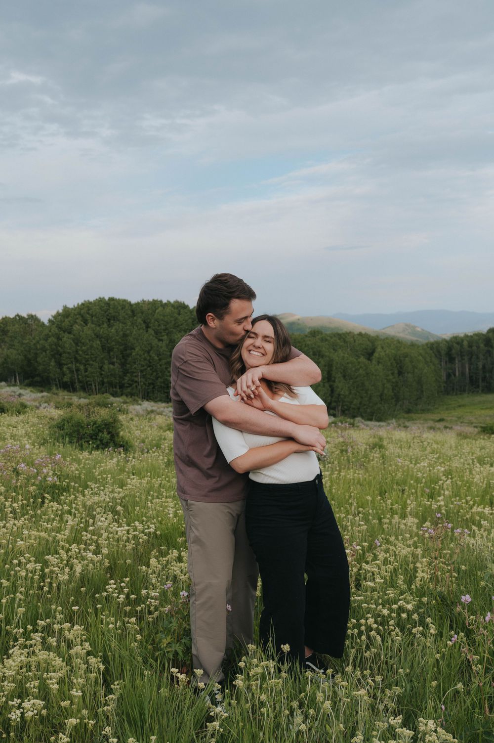 An engaged couple beautifully photographed during their summer engagement session in Park City, Utah.