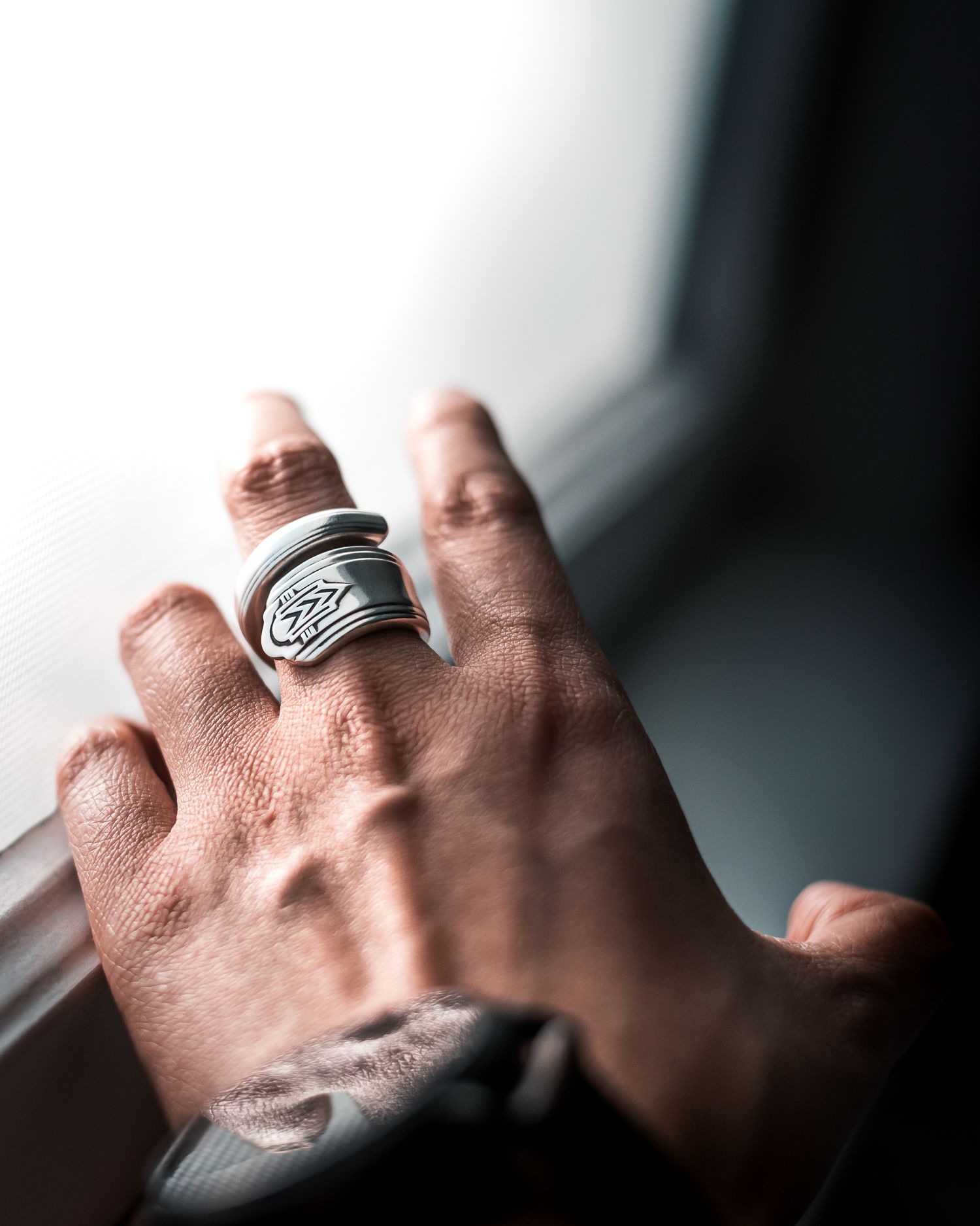 Product photography of spoon ring near window