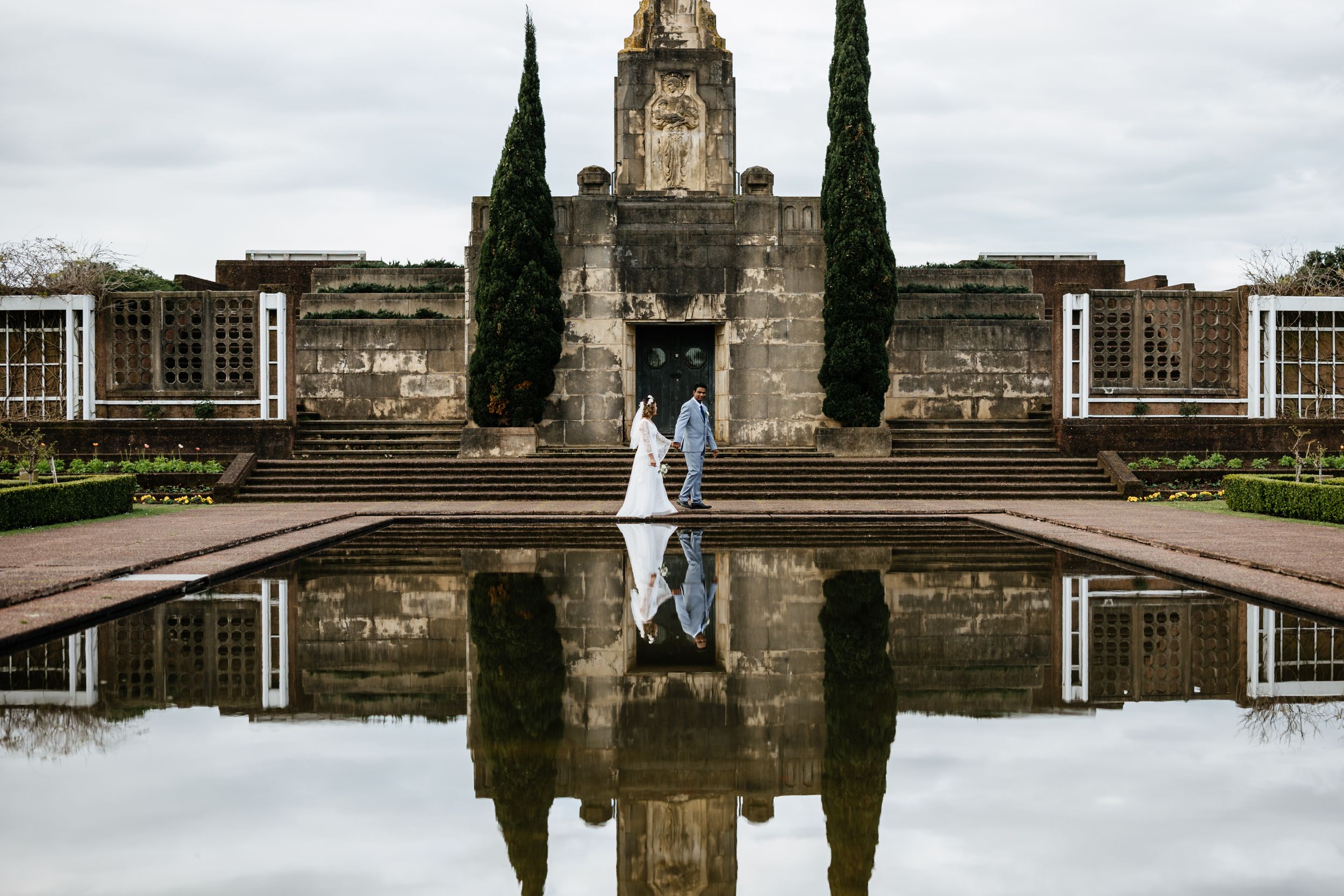 Couple posing in-front of Bastion Point at Mission Bay Auckland