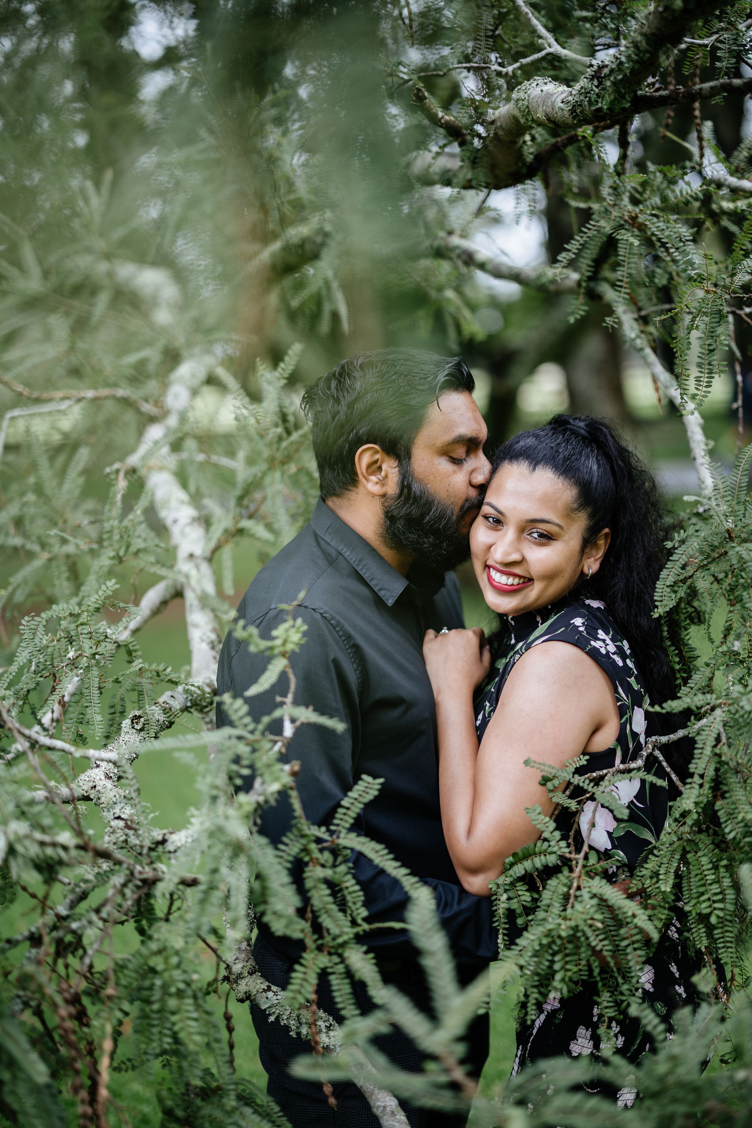 Couple posing under the tree at Cornwall Park, Green Lane Auckland