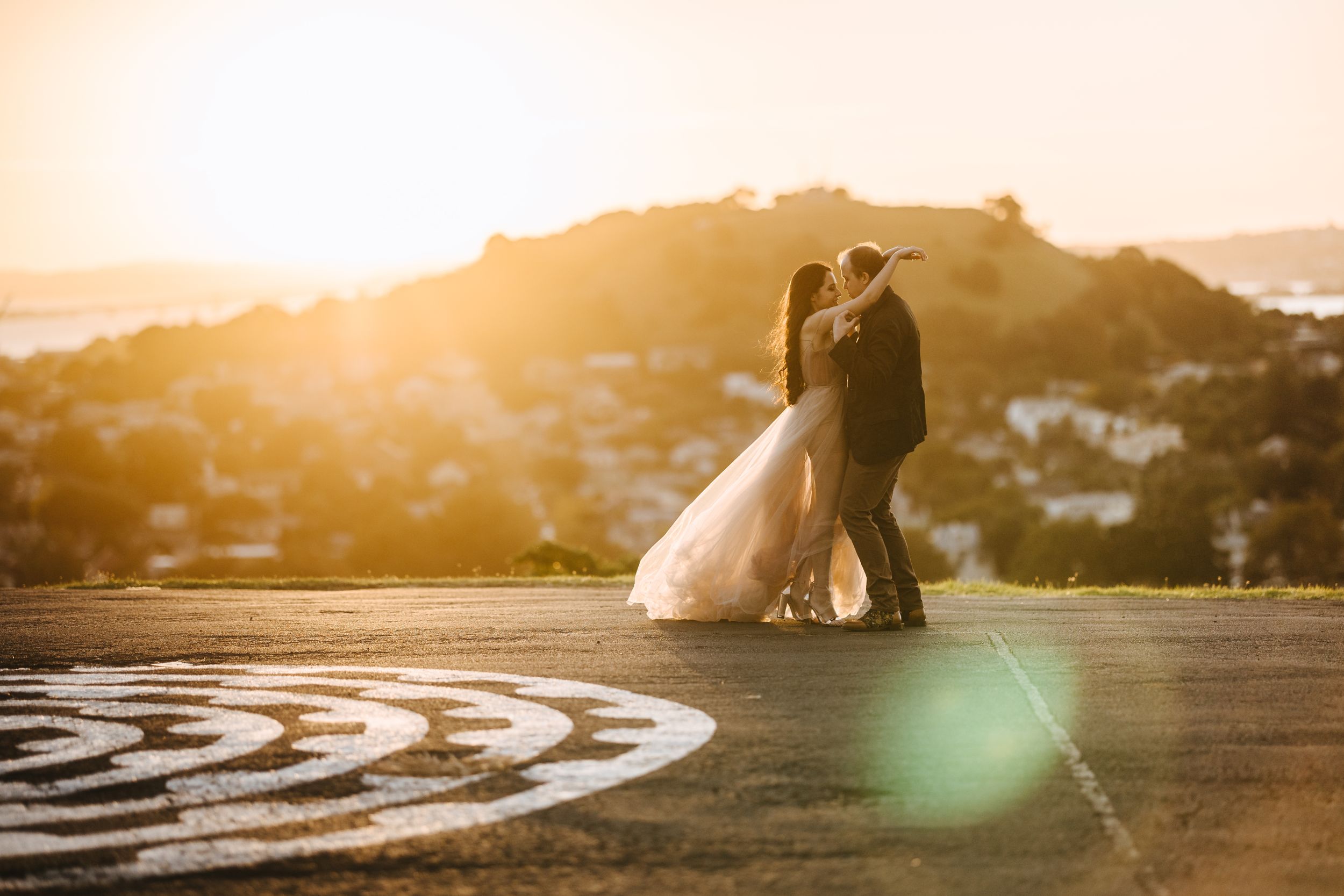 Couple posing during sunset time at The Summit at North head Historic Reserve, Devonport Auckland