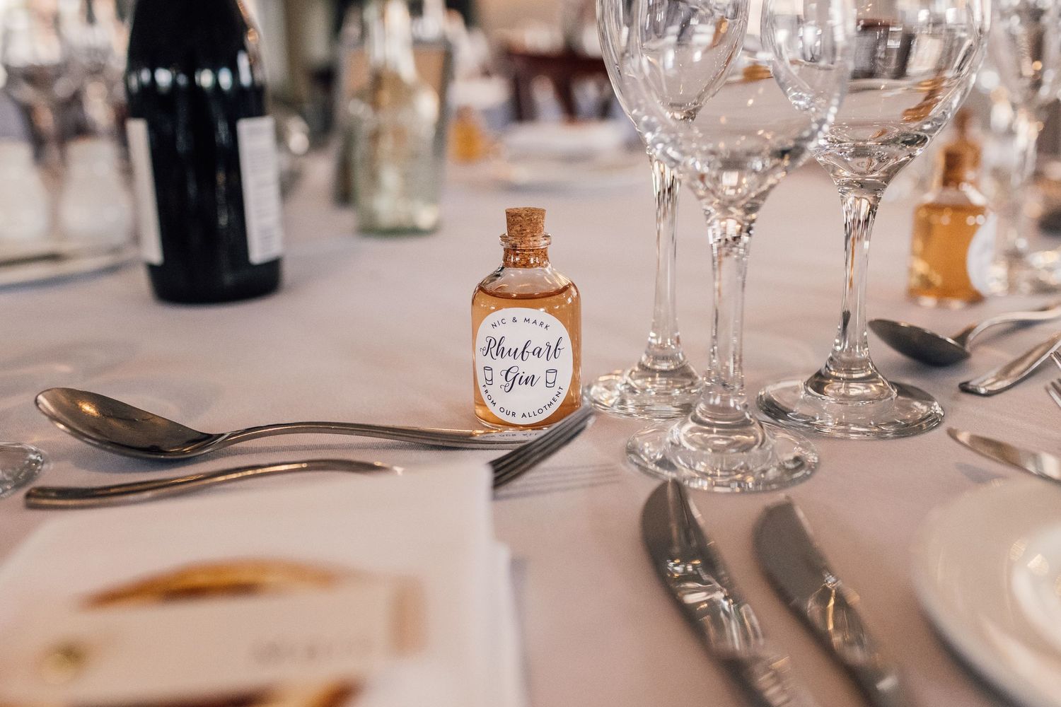 close up of small bottle of rhubarb gin