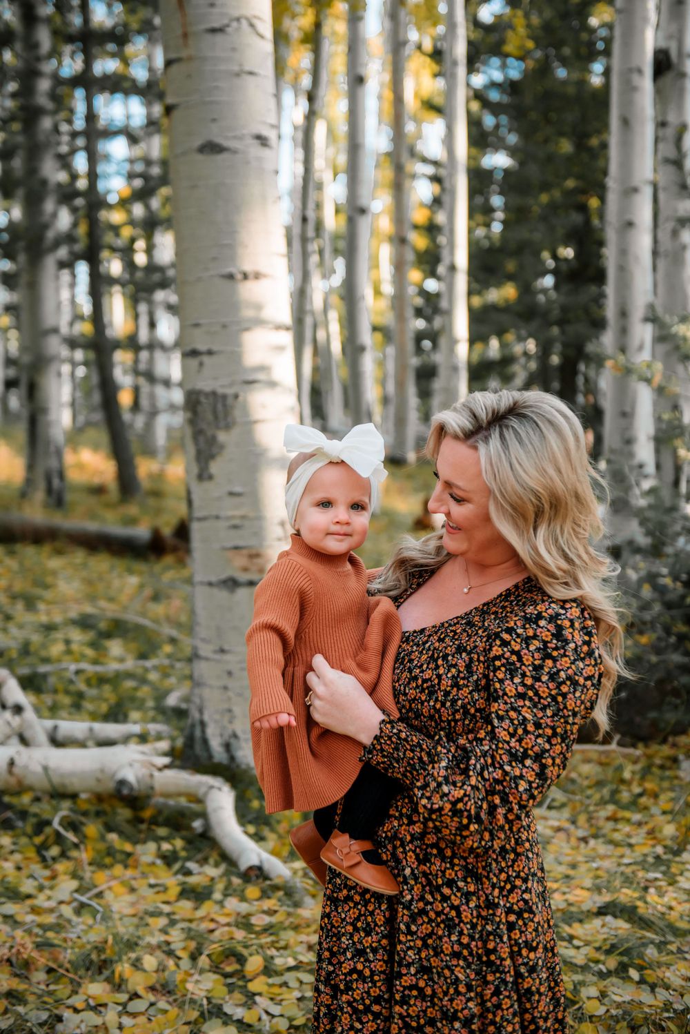 Candid moments captured in a golden aspen grove during fall.