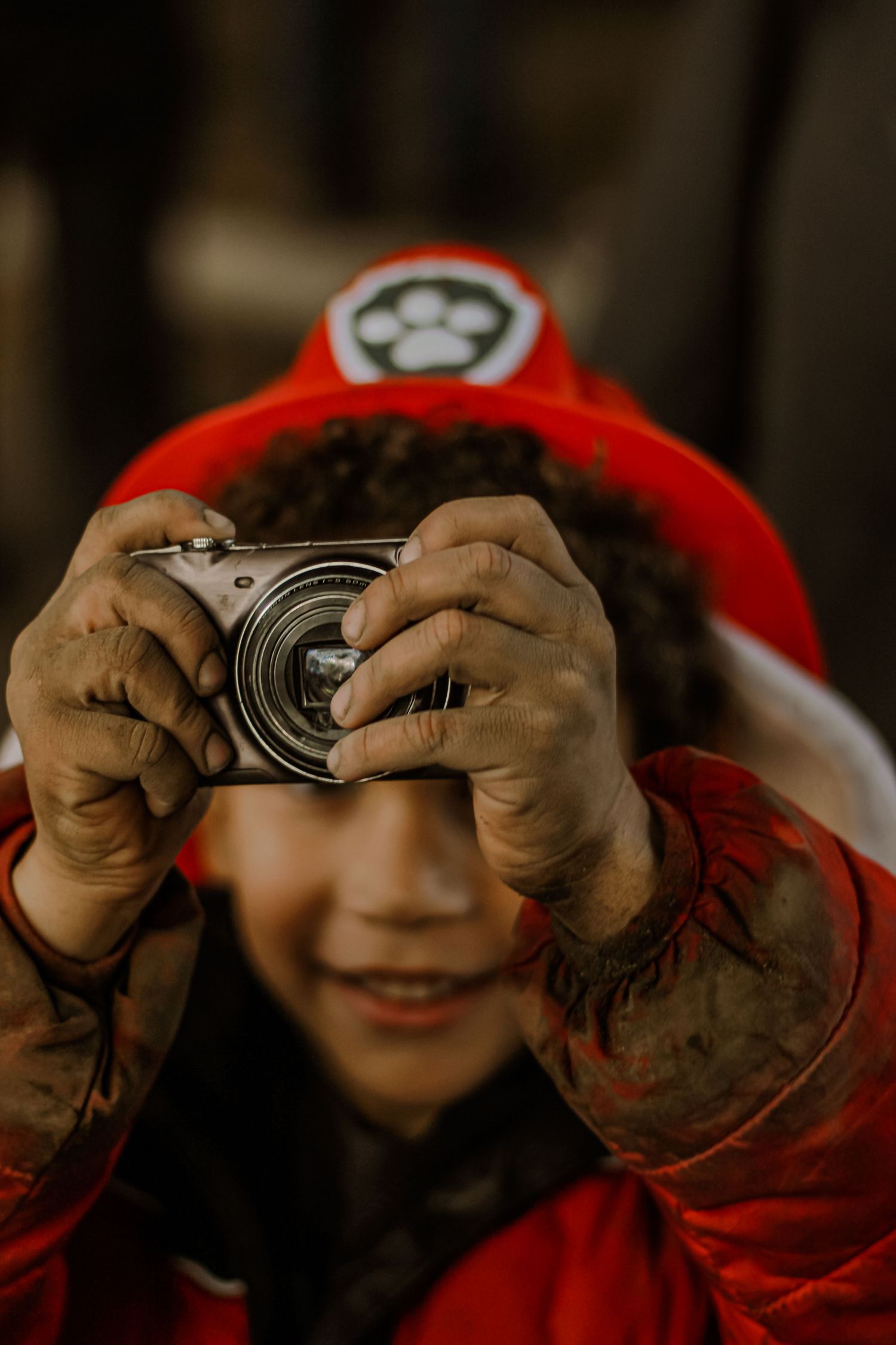 A child shows me his camera at a local community event