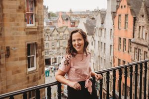 Viewpoint overlooking historic Edinburgh architecture with stone buildings and steep streets.
