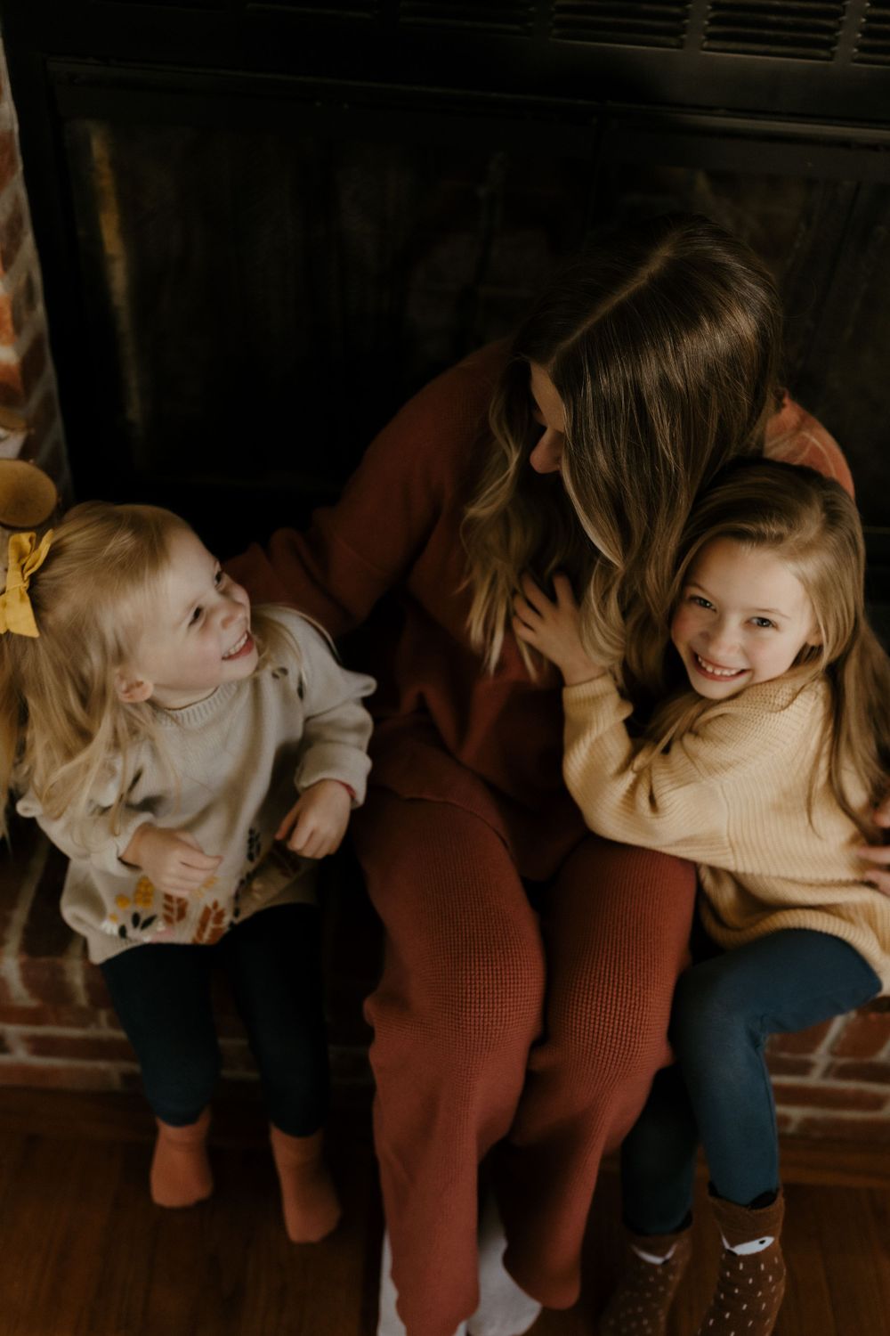 Candid family portrait in Joplin, Missouri captured in natural light by Modern Moods Imagery, showing genuine connection and movement.