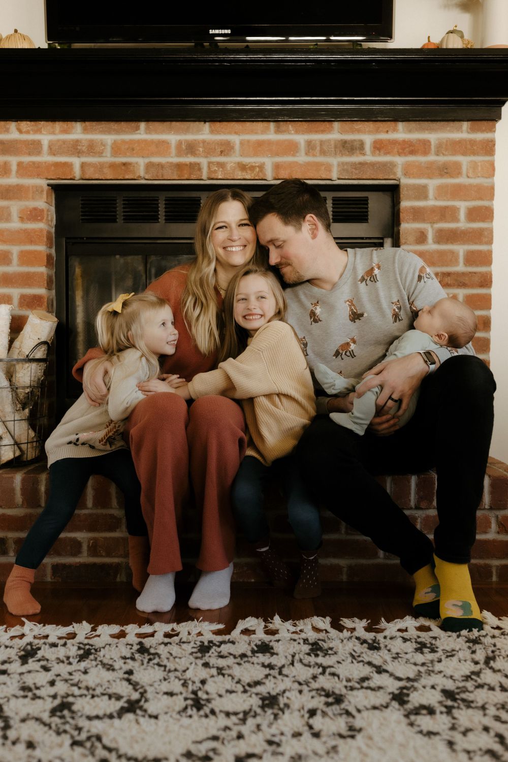 Candid family portrait in Joplin, Missouri captured in natural light by Modern Moods Imagery, showing genuine connection and movement.