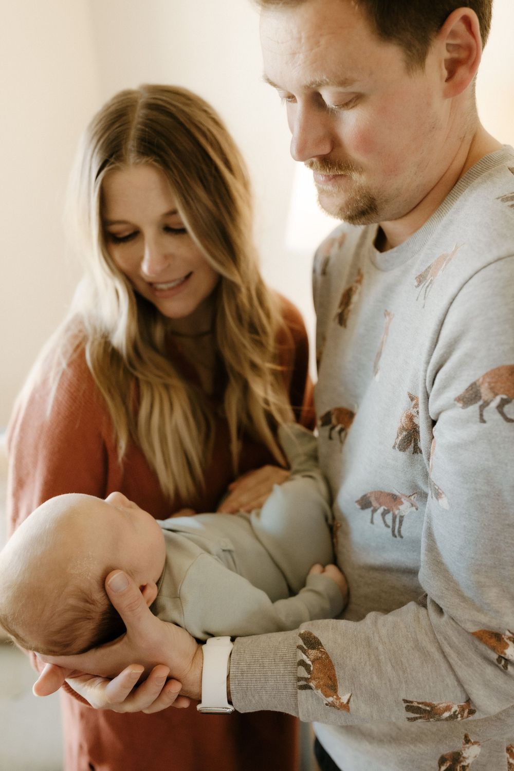 Candid family portrait in Joplin, Missouri captured in natural light by Modern Moods Imagery, showing genuine connection and movement.