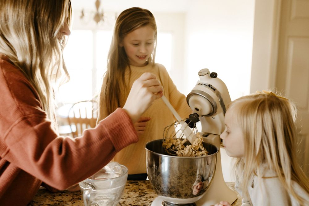 Candid family portrait in Joplin, Missouri captured in natural light by Modern Moods Imagery, showing genuine connection and movement.