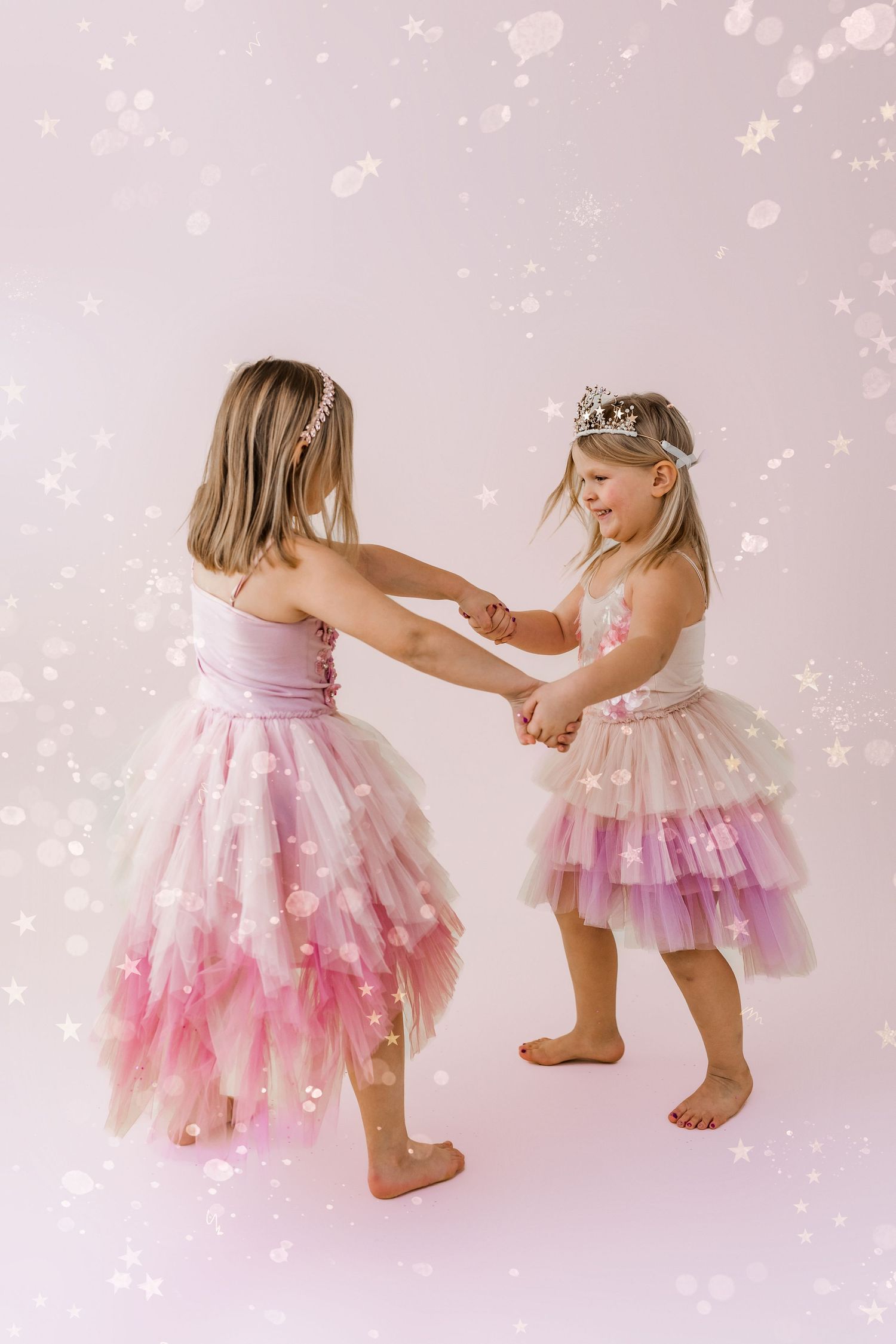 two girls twirling in a circle together