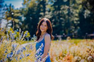 beautiful senior portrait in a colorful garden with blooming flowers