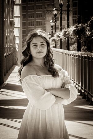 A classic folded arms pose in sepia tone with cool wash colors is a stunning image