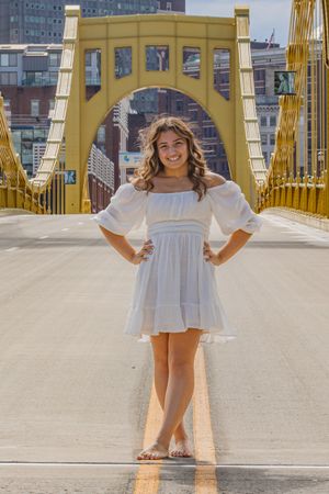 Posing barefoot on a city bridge, why not!