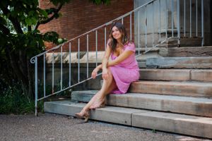 Feminine and classy, this sitting pose on stone steps is a guaranteed beautiful image