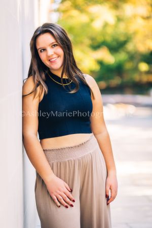 Excitement and youth are captured in this thoughtful pose for a senior portrait.