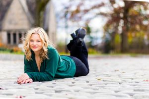 Laying on cobblestone, this girl gives off a timeless vibe
