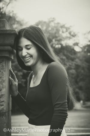 A beautiful candid shot caught just as a young girl looks away and laughs