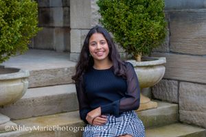 Feminine and classy, this sitting pose on stone steps is a guaranteed beautiful image