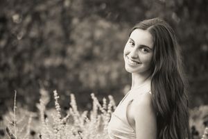 A classic pose of a girl looking over her shoulder