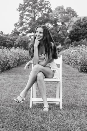 Beautiful stunning senior portrait of a girl looking off camera in a thoughtful pose