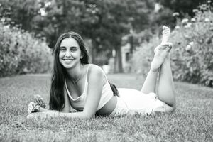 Nothing but smiles and laughs during this scene of a girl laying in a field of flowers