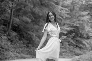 Showing off the Flow of her dress, this girl takes a spin for fun!