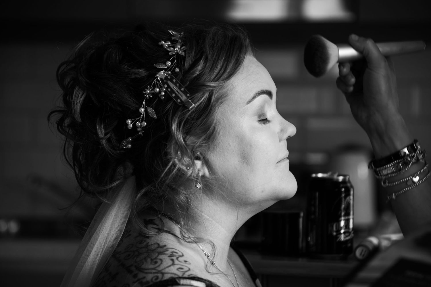 Artistic black and white portrait capturing a wedding day moment.