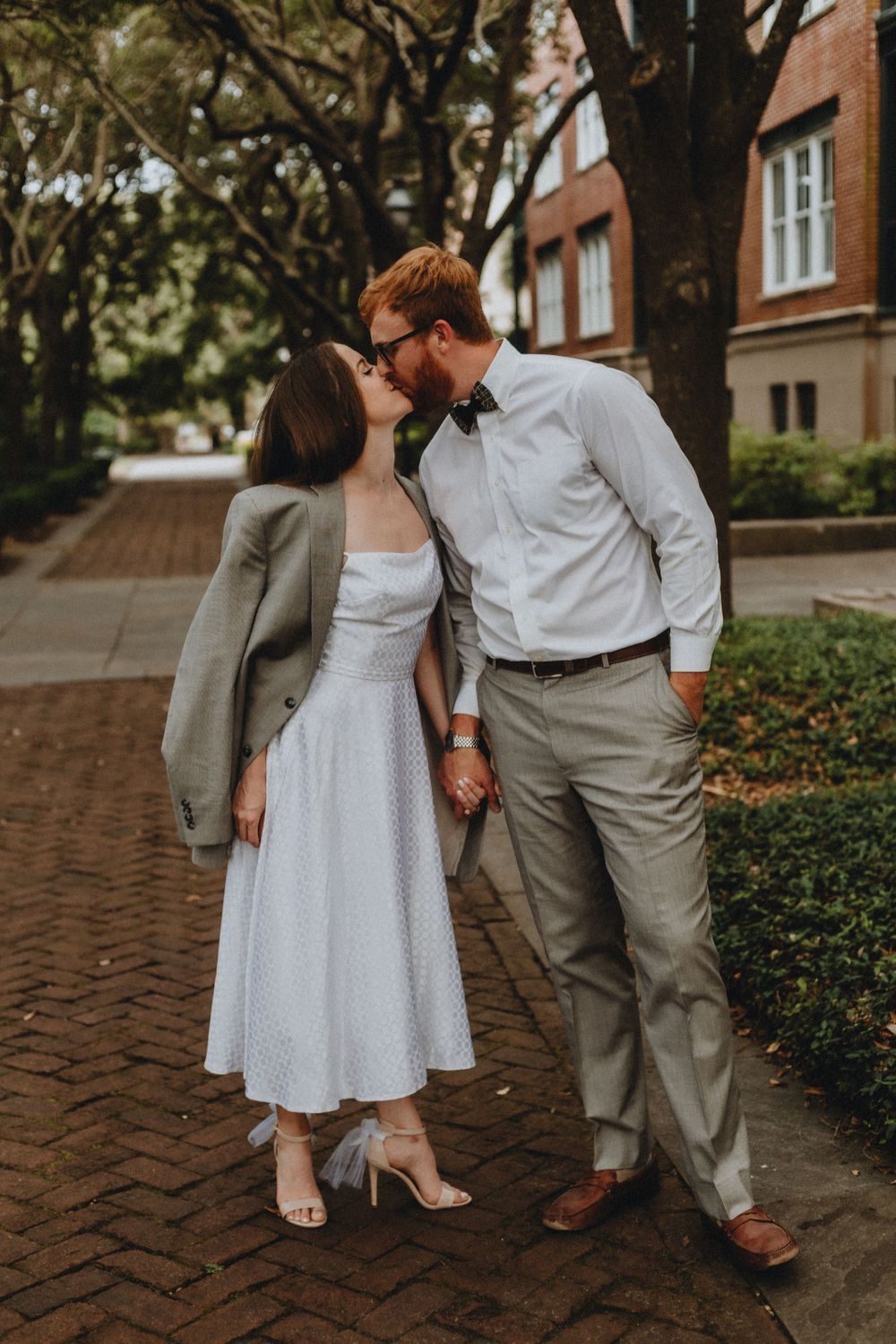 A couple shares a kiss at Waterfront Park in Charleston