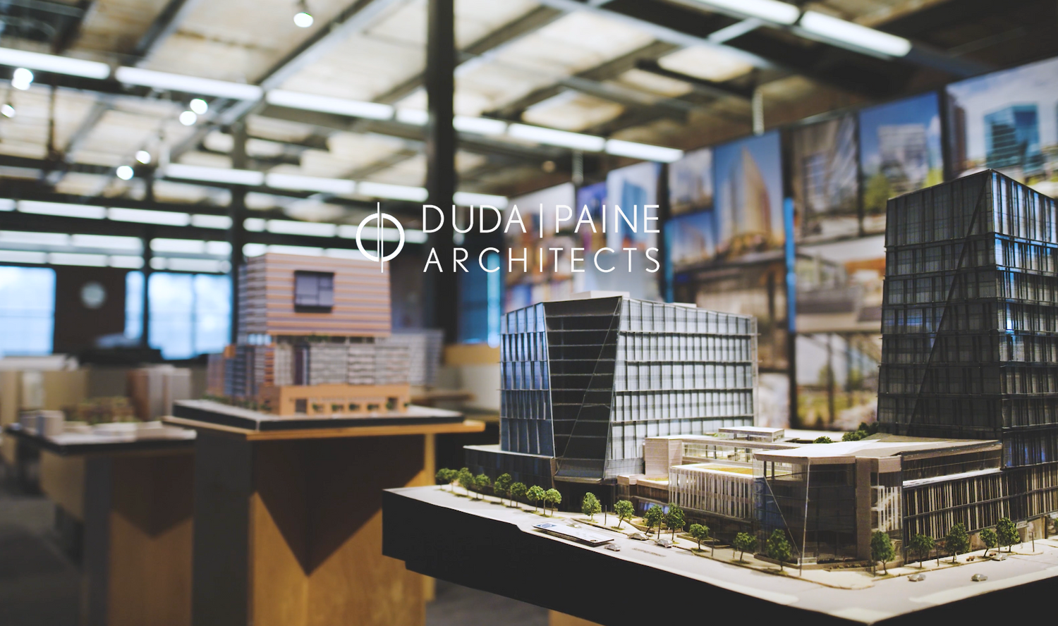 Architectural scale model of modern urban development project with multiple buildings.