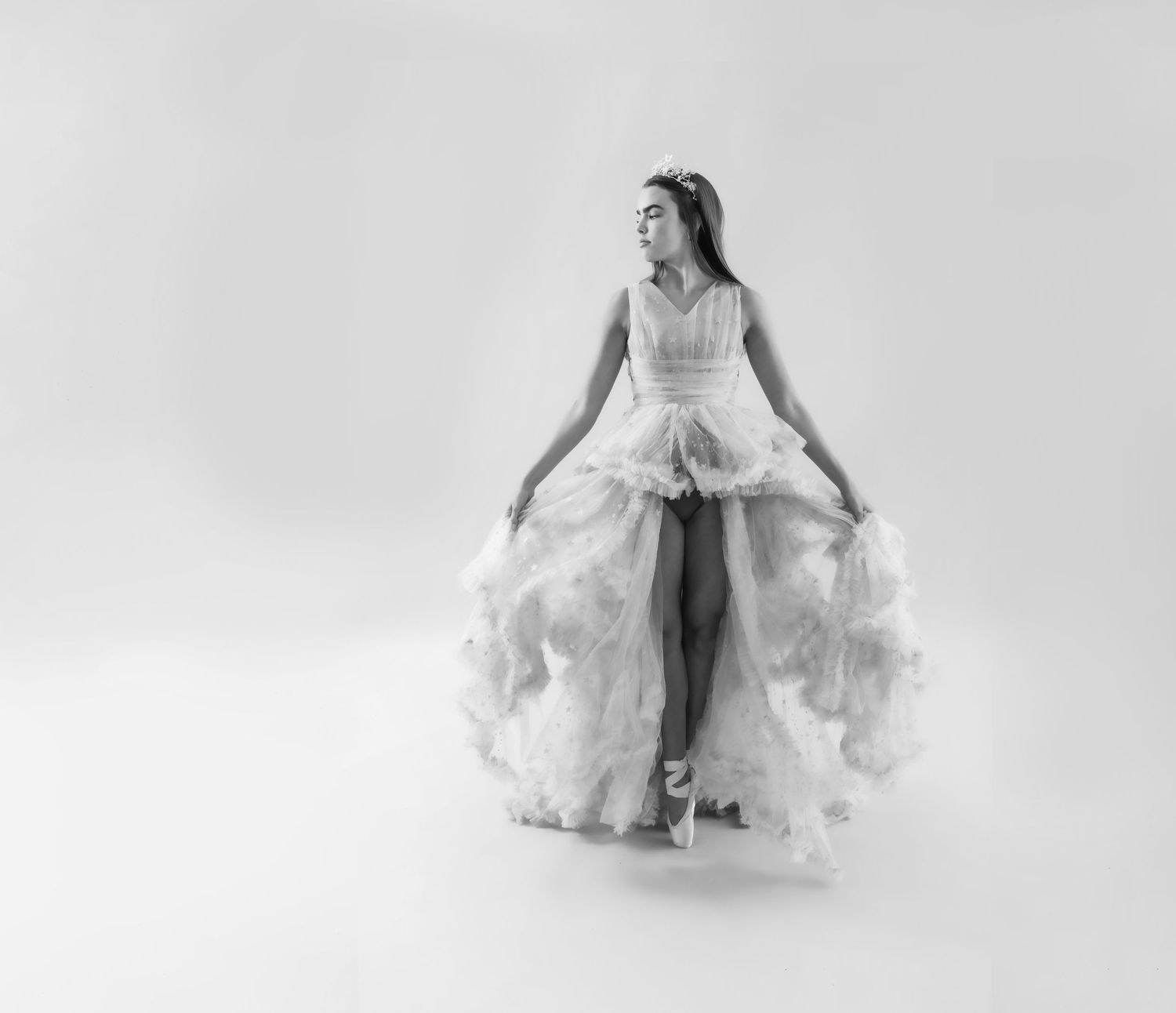 Artistic portrait series showing flowing white dress movement against light background.