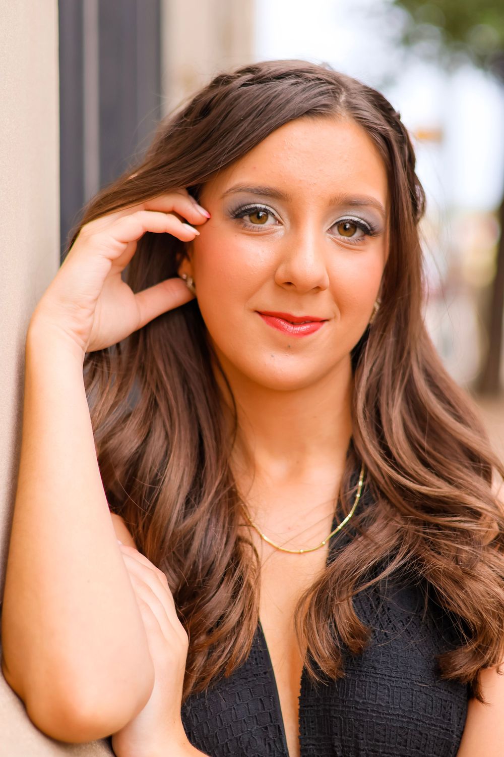 Series of close-up portraits showing a young woman with flowing brunette hair against a blurred background.