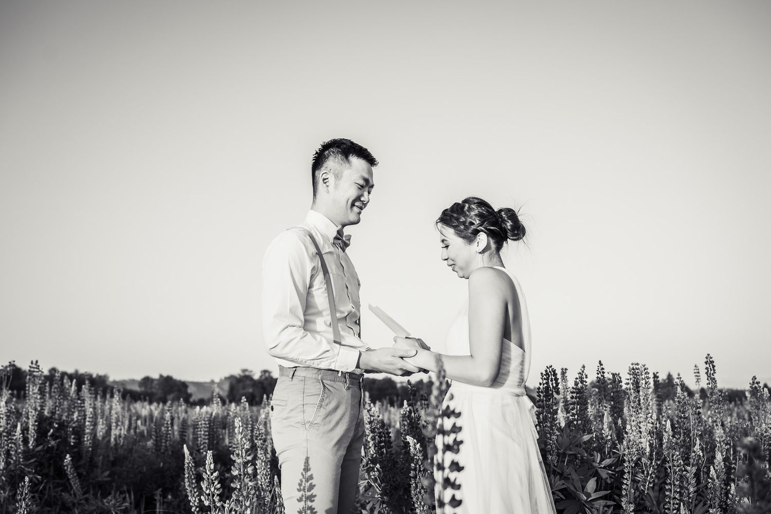 Black and white photo of husband and wife exchanging vows.