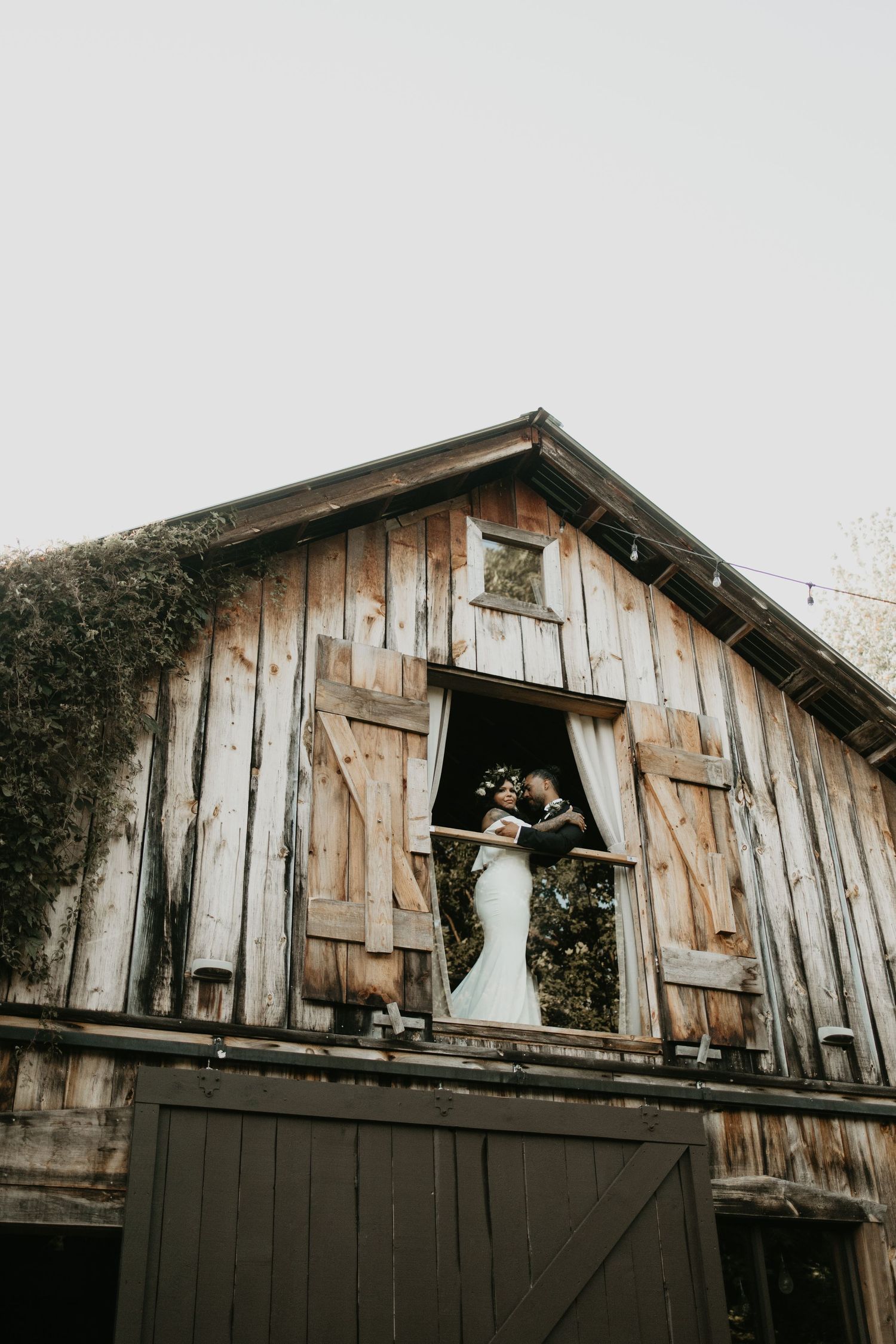 Couple on wedding day in barn