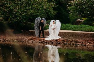 Romantic garden wedding photography near a tranquil pond with natural scenery.