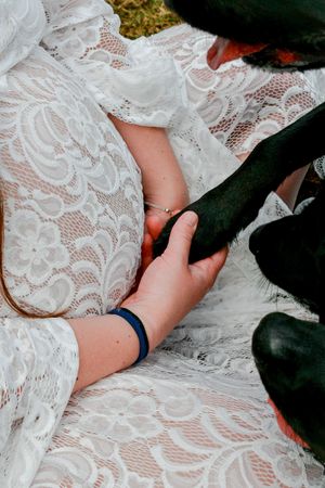 White lace wedding dress detail with delicate floral patterns.