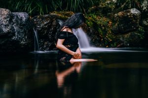 Long exposure waterfall photography with smooth flowing water in a natural setting.