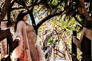 Artistic photo sequence under palm trees with flowing fabric and natural lighting.