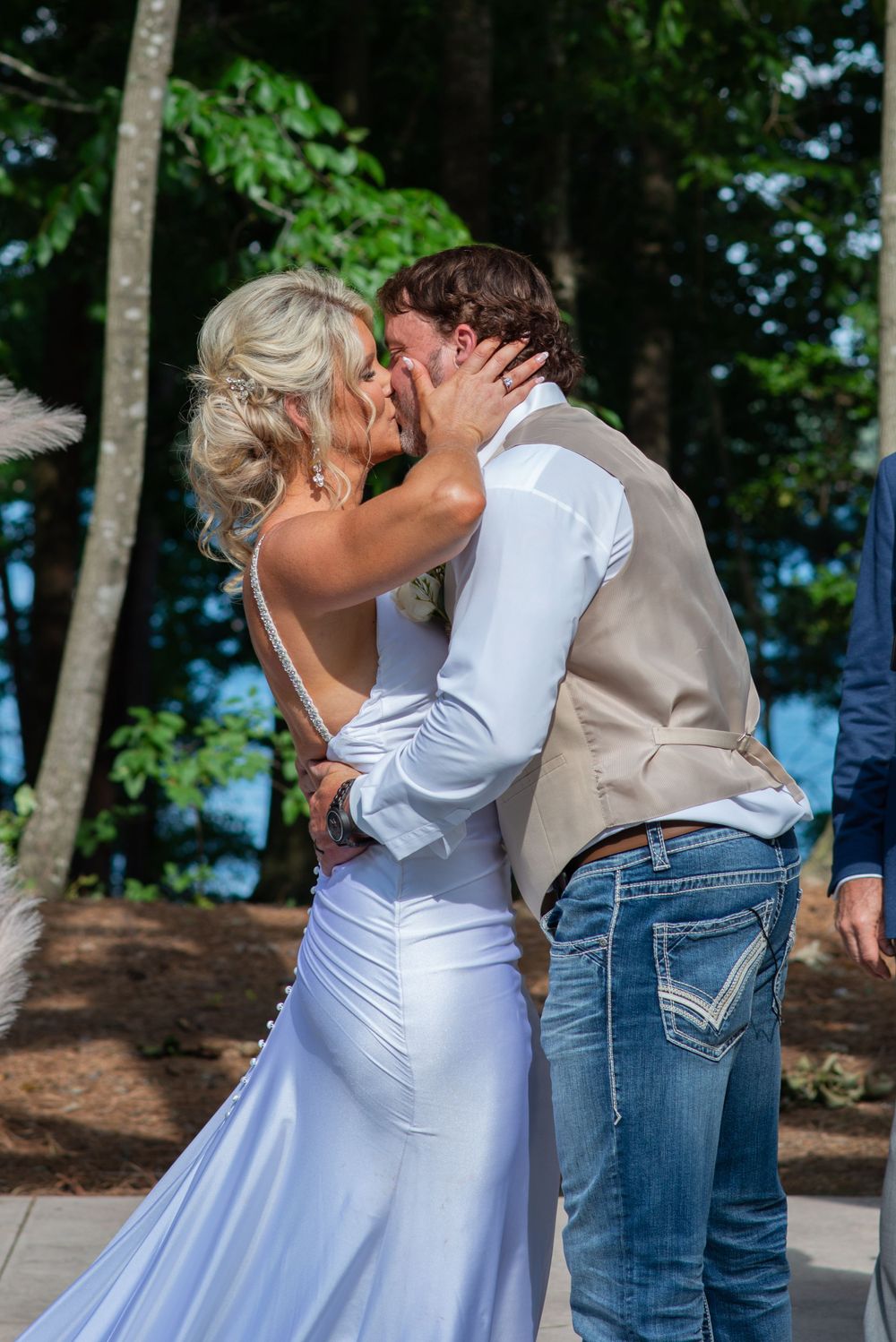 bride and groom share first kiss as husband and wife after their ceremony at Lanier islands