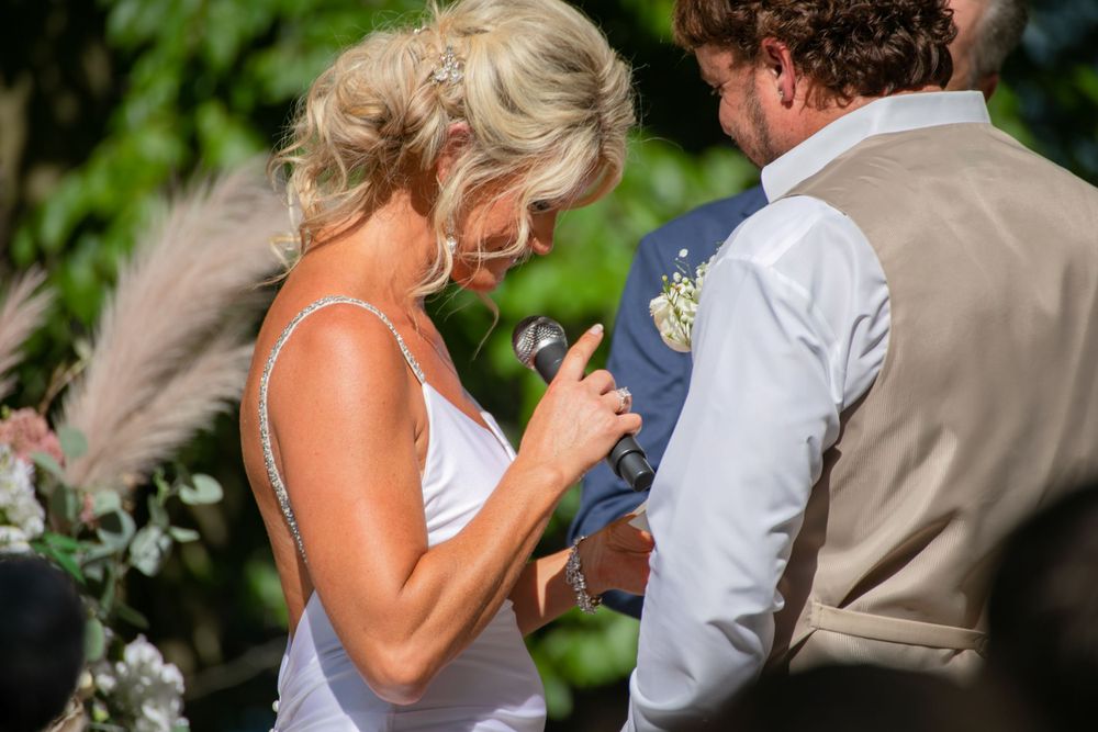 bride and groom share vows during their wedding at Lanier islands in georgia