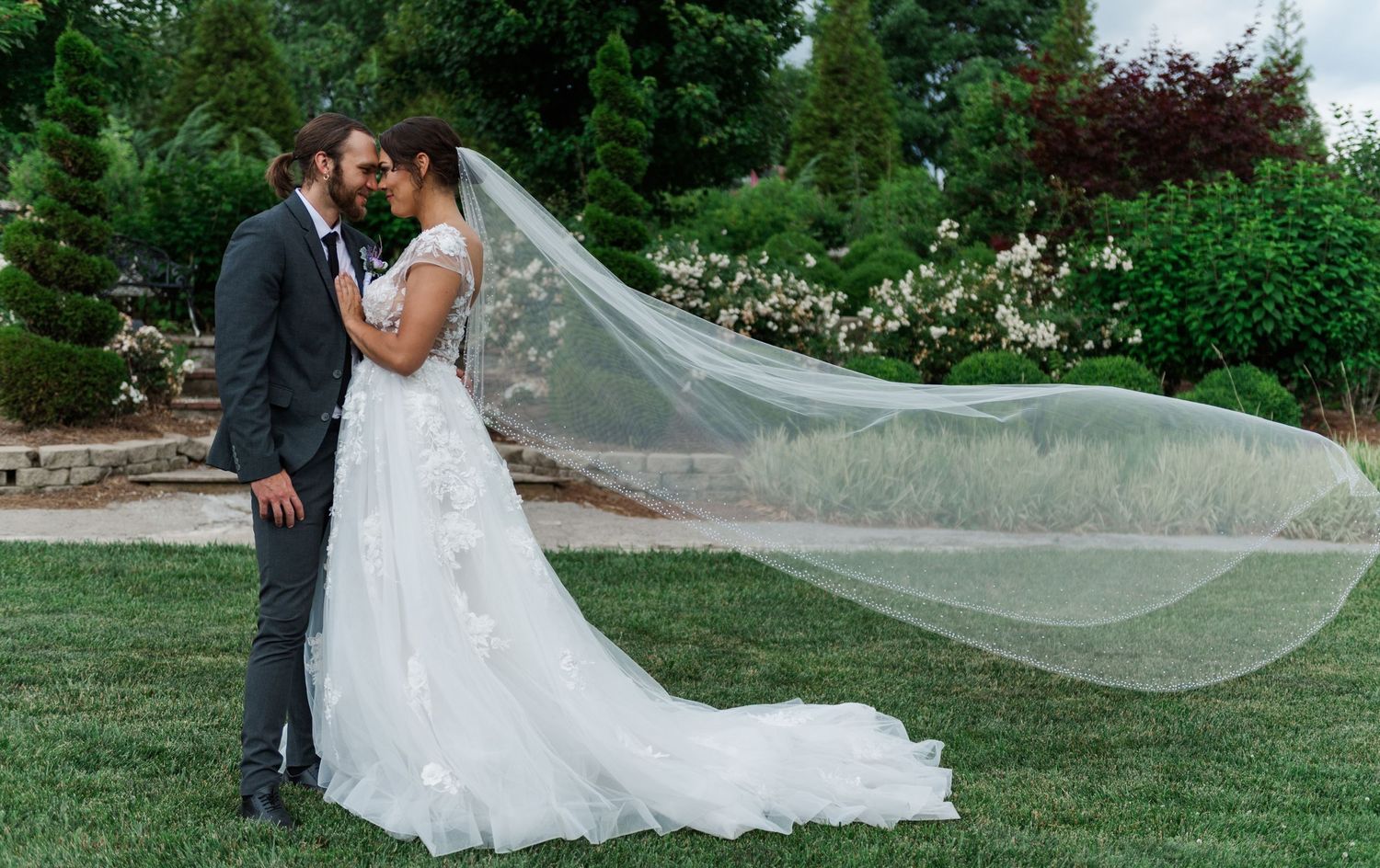 Indianapolis Indiana Wedding Photographer prices listed with this wedding photo of a bride with her veil flying