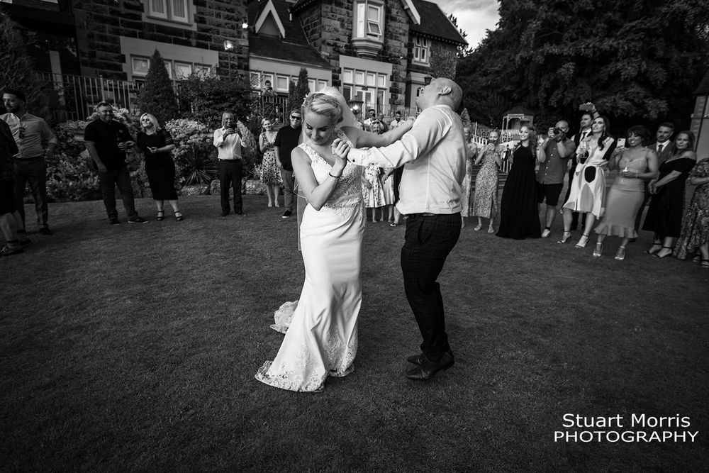 Bride and grooms first dance in the gardens at west tower country house. Lancashire wedding photographer.