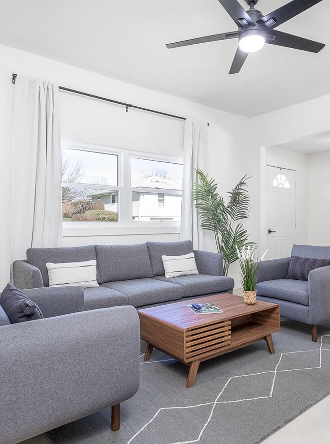 Crisp white walled living room with ultra modern furniture