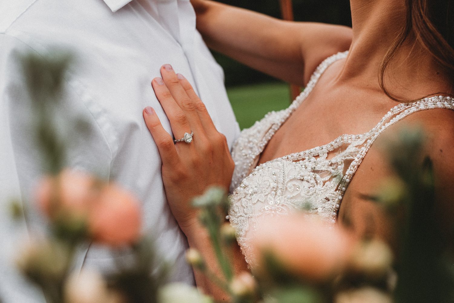 detail shot of wedding rings and bouquet
