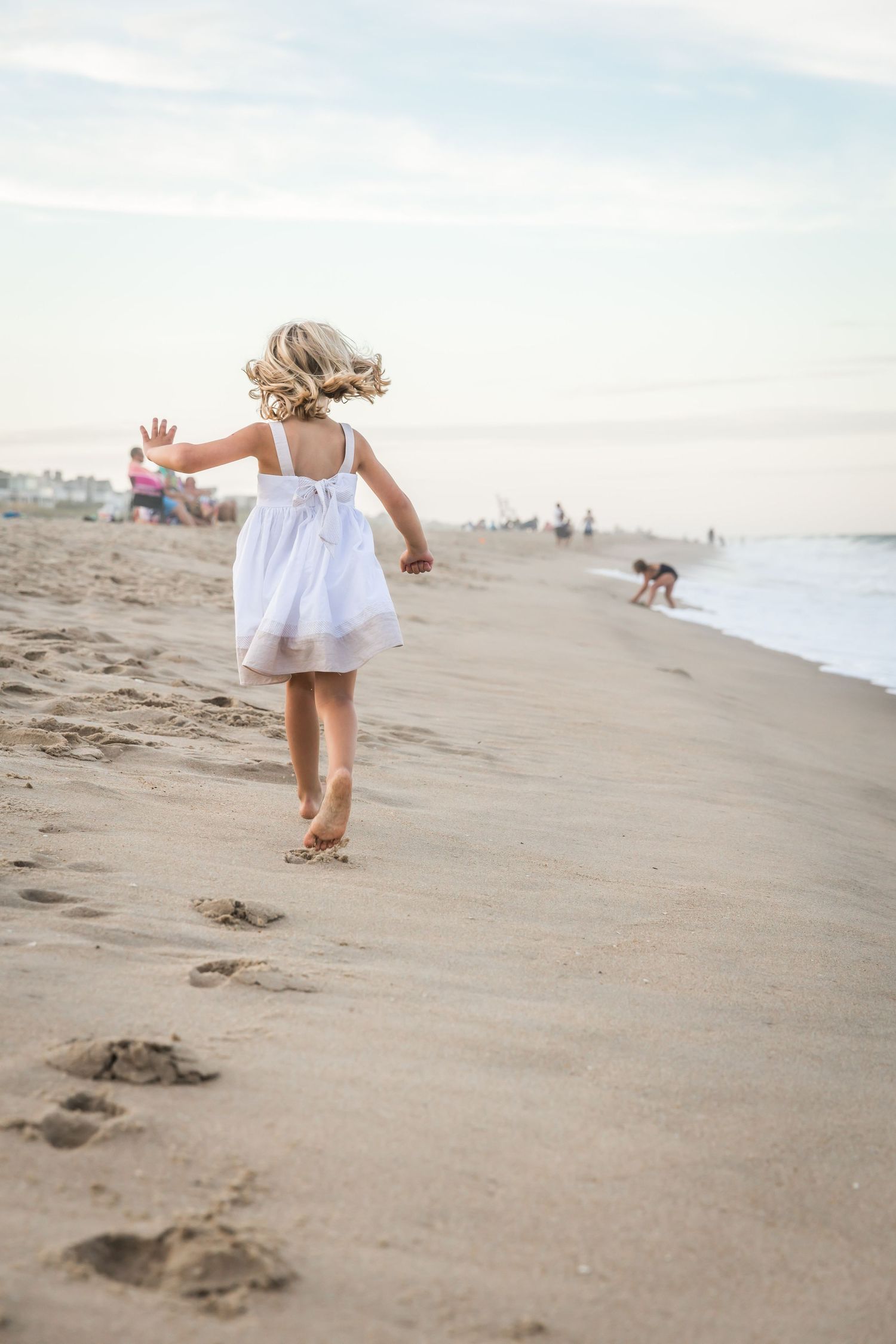 Young girl running on the beach
