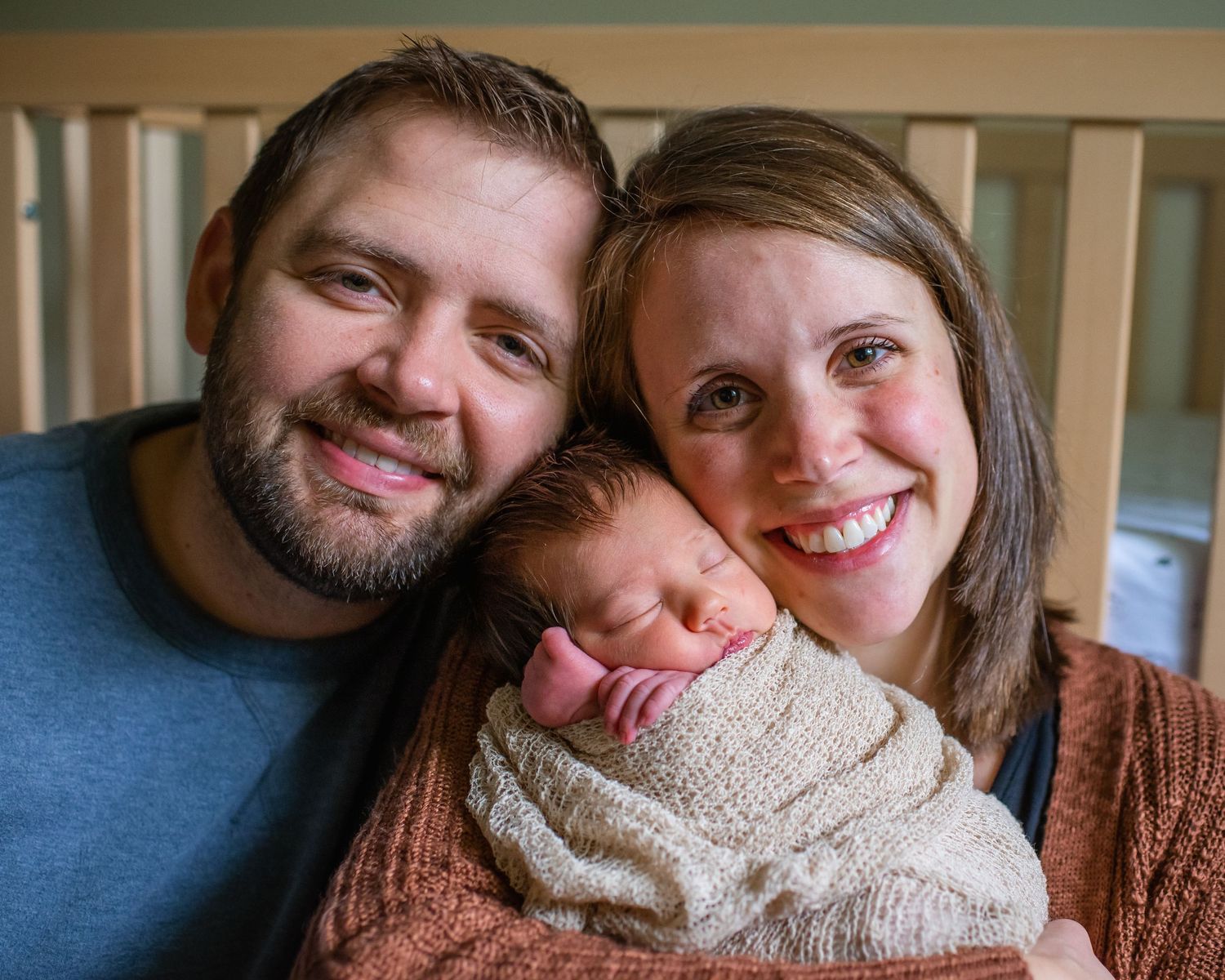 A tender family moment captured in natural light shows warmth and connection.