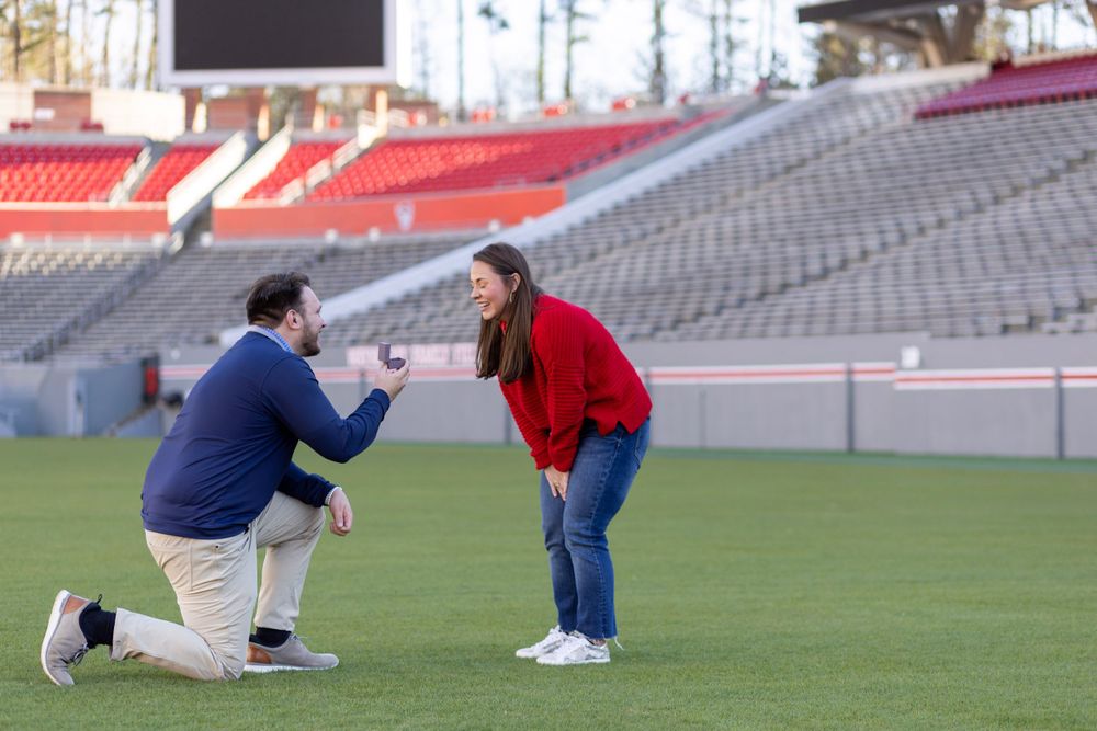 A women reacts to being proposed to at Carter Finley Stadium at NC State University in Raleigh, NC.