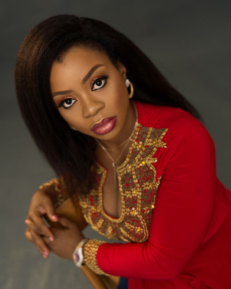 corporate female African head-shot photograph, red dress female portrait