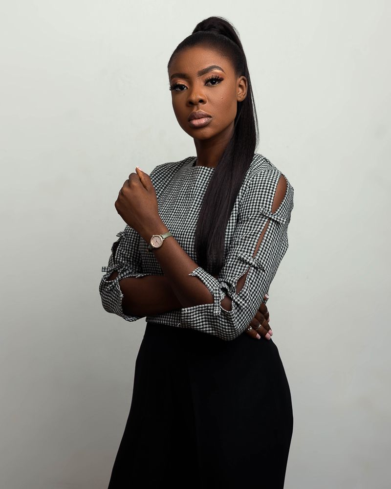 female african corporate head-shot photograph with pony tail hair