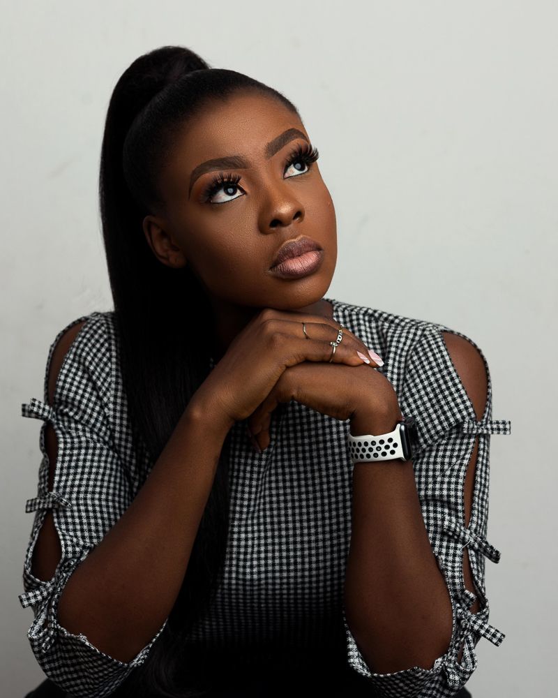 female african corporate head-shot photograph with pony tail hair